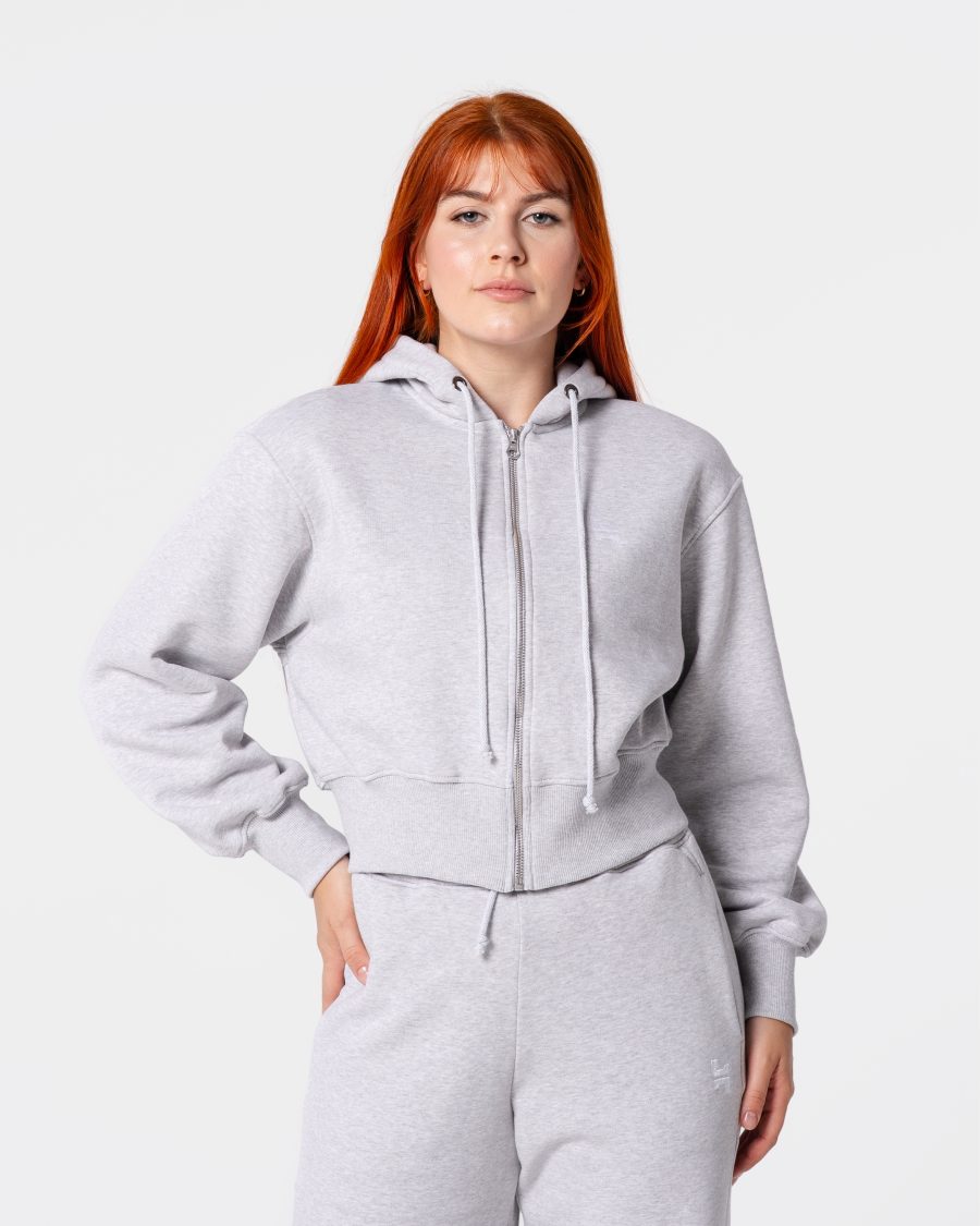 dresy damskie - szara bluza dresowa z metalowym zamkiem. jest w szarym kolorze. posiada duży kaptur.