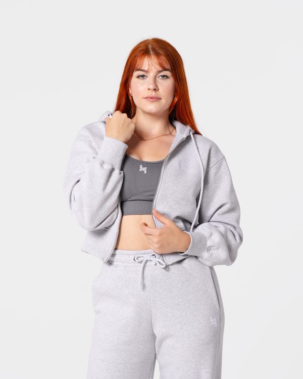 dresy damskie - szara bluza dresowa z metalowym zamkiem. jest w szarym kolorze. posiada duży kaptur.