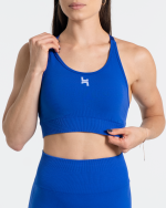 stanik sportowy w kolorze niebieskim. ma ragulowane ramiączka i bardzo dobre podtrzymanie. świetny do biegania i na siłownię.